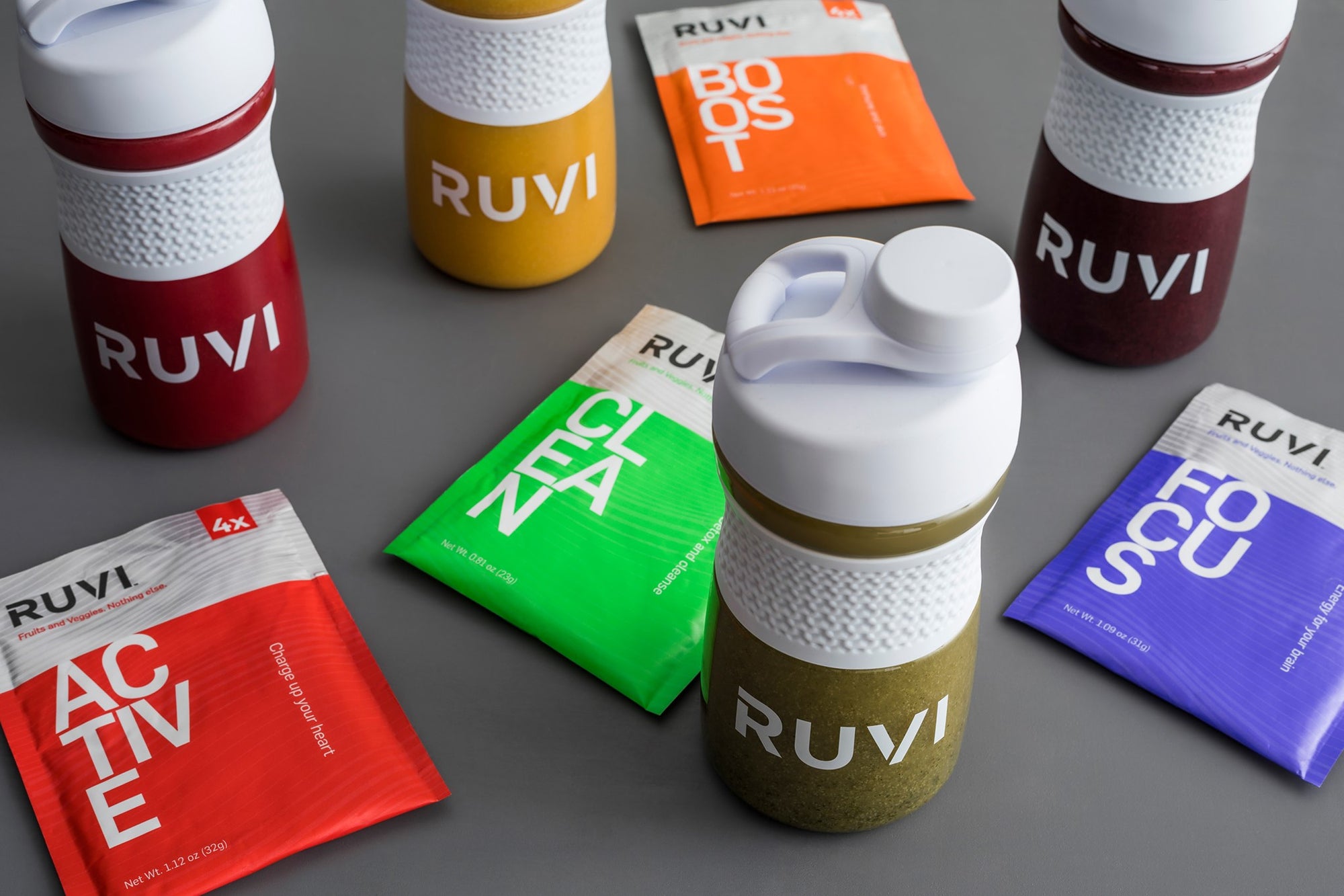 4 Ruvi blend flavors Active, Boost, Clean, Focus in shaker bottles with packages surrounding