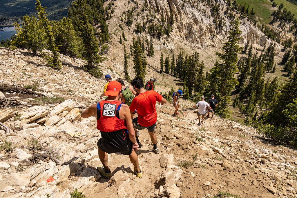People running down a steep hill at Cirque Series Brighton 2021 Mountain Trail Running Event