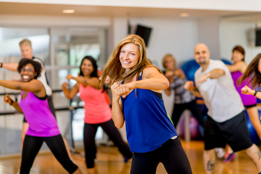 Woman leading a class in boxing exercises 